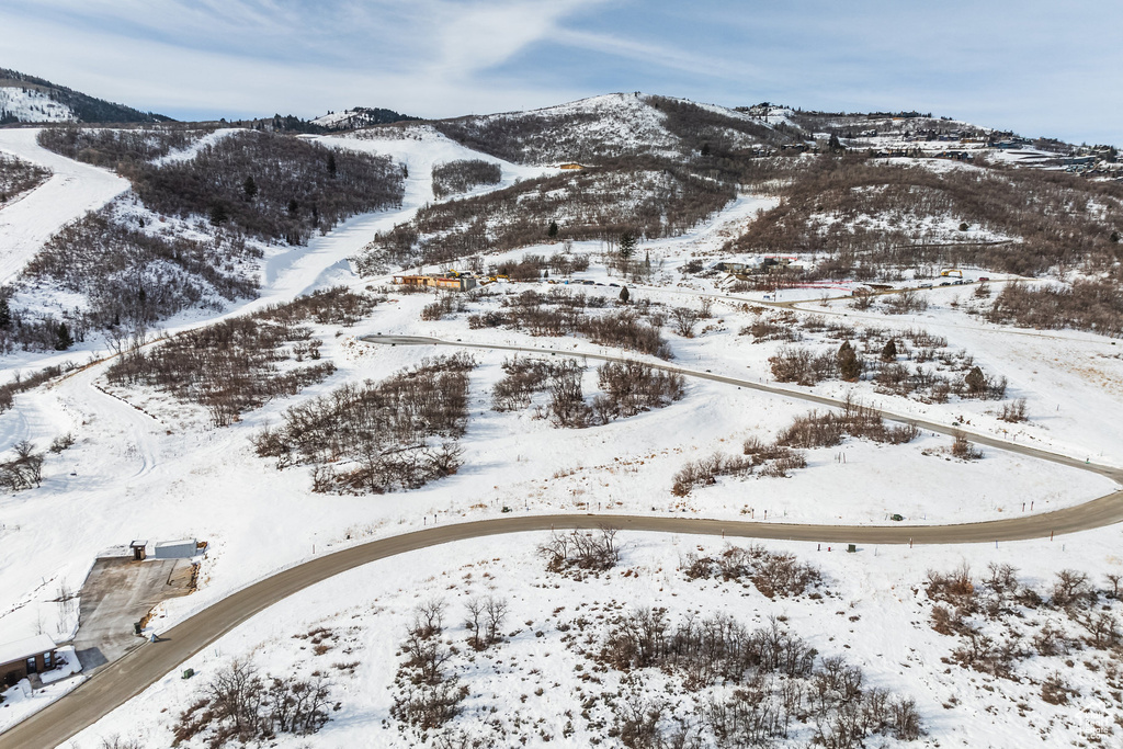 Snowy aerial view with a mountain view