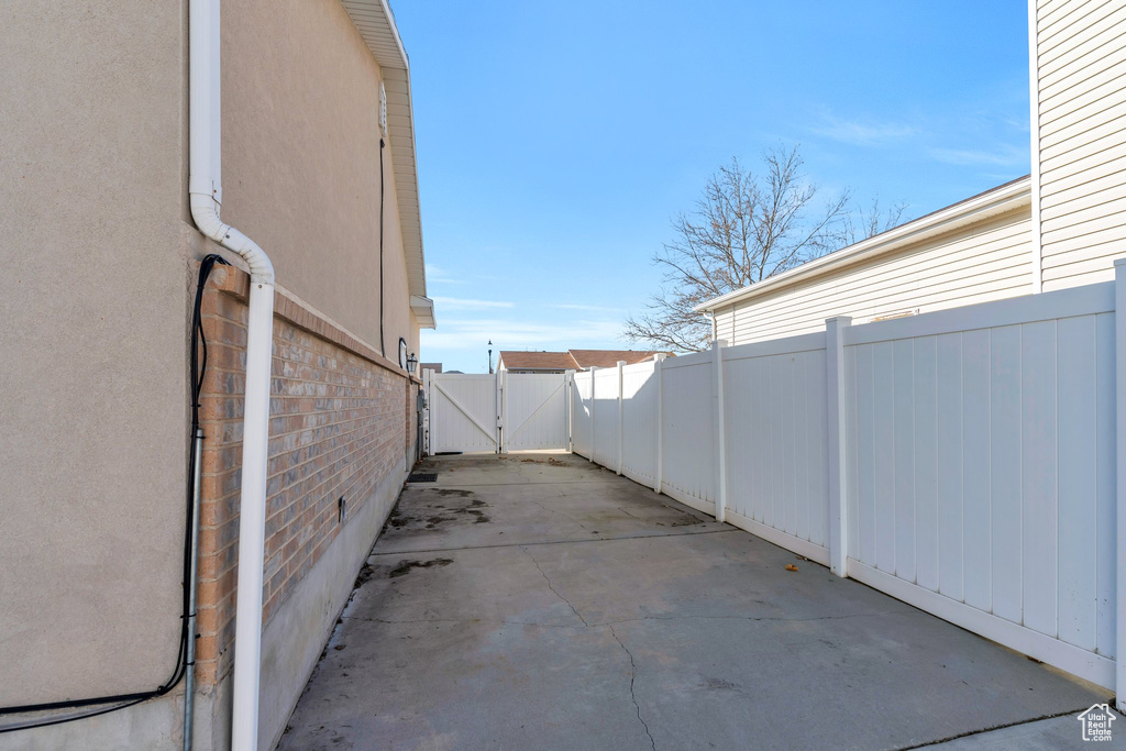 View of patio / terrace with a gate and fence