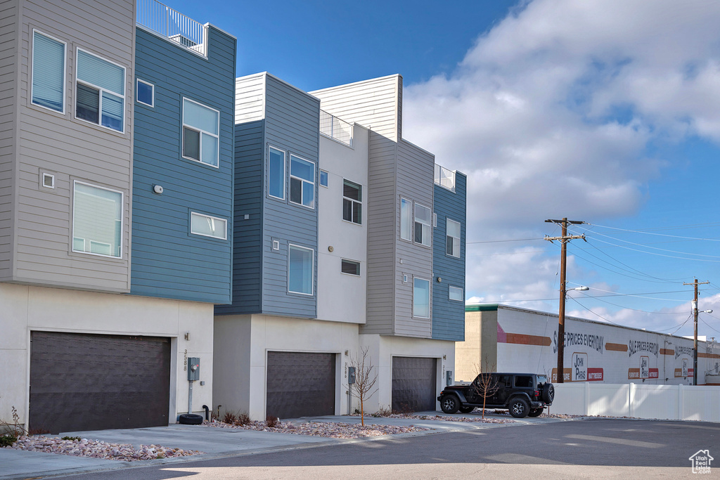 View of property featuring a garage