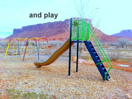 Communal playground featuring a mountain view