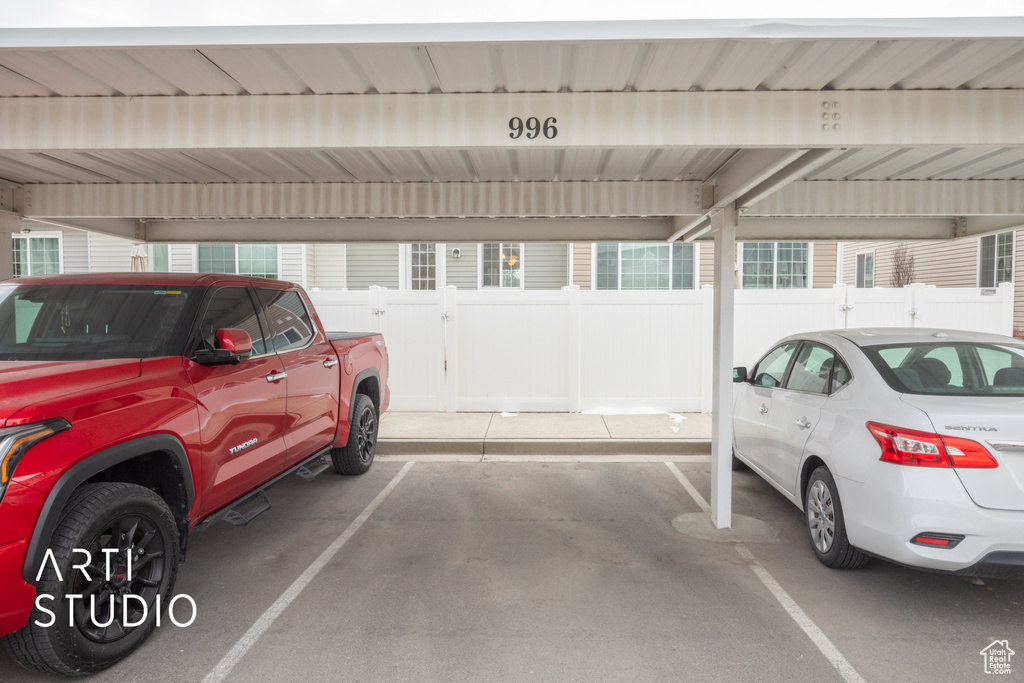 Garage with covered parking and fence