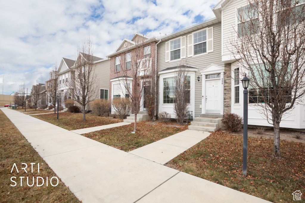 Townhome / multi-family property featuring a residential view