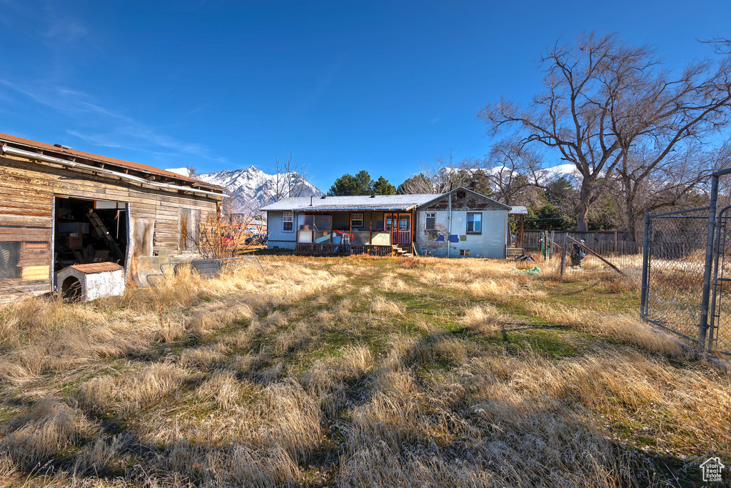 View of yard featuring fence and a mountain view