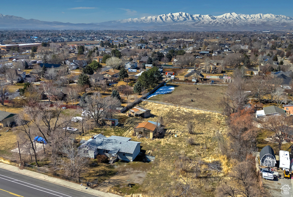 Drone / aerial view with a residential view and a mountain view