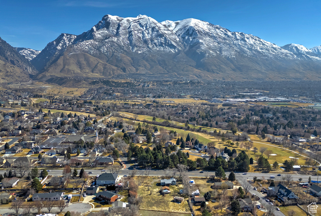 Property view of mountains with a residential view