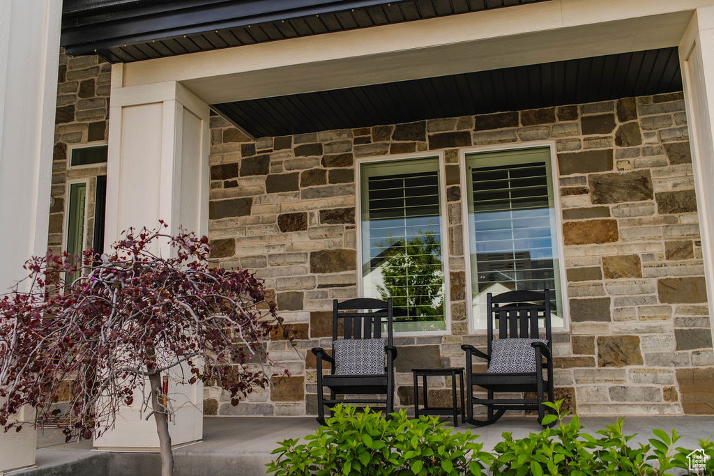 Doorway to property featuring stone siding