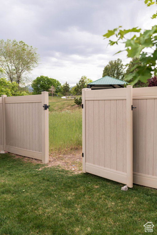 View of yard featuring a gate