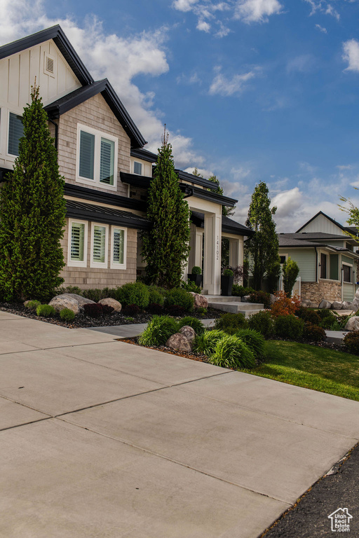 View of front facade featuring board and batten siding