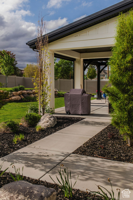 View of patio featuring fence