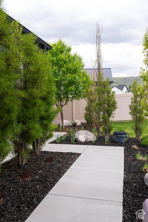 View of yard with fence and a patio area