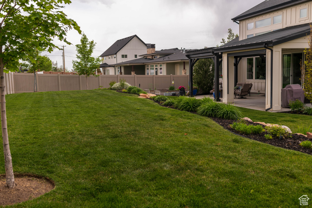 View of yard with a patio and a pergola