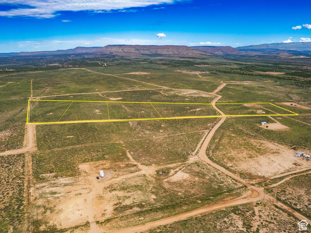 Birds eye view of property featuring a mountain view and a rural view