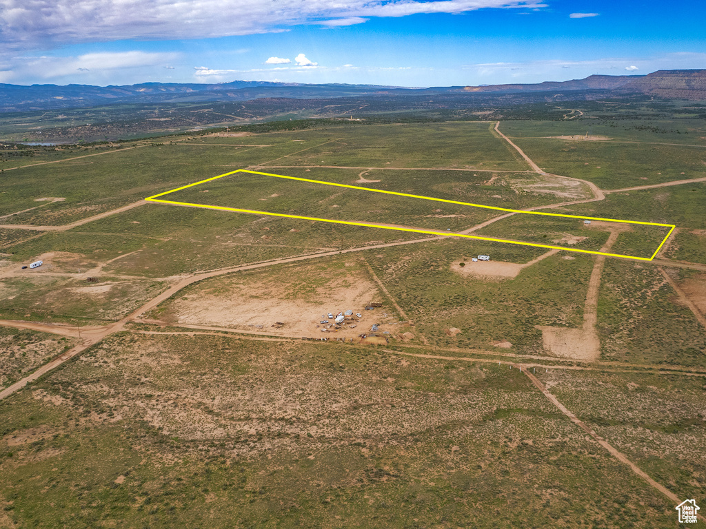 Birds eye view of property with a rural view and a mountain view