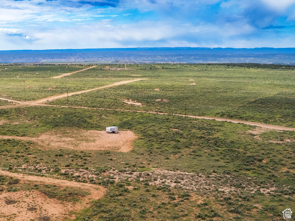 Birds eye view of property featuring a rural view