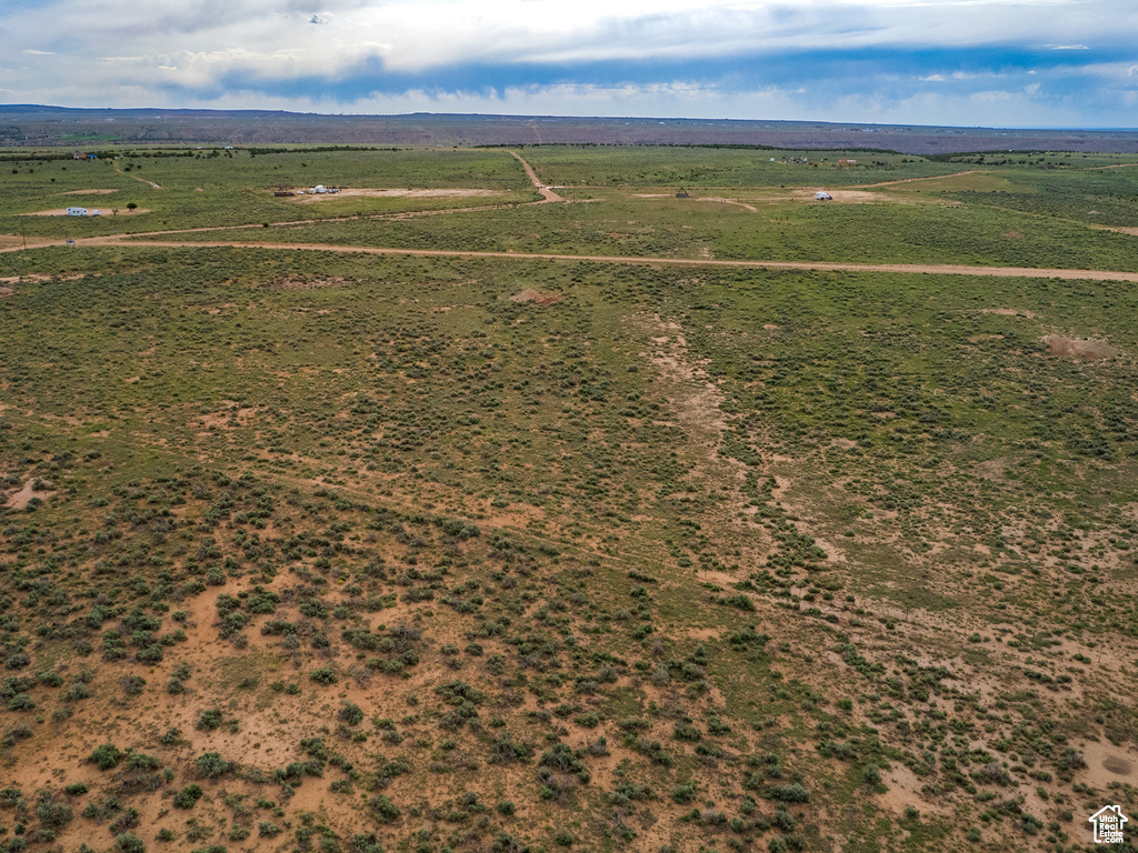 Birds eye view of property with a rural view