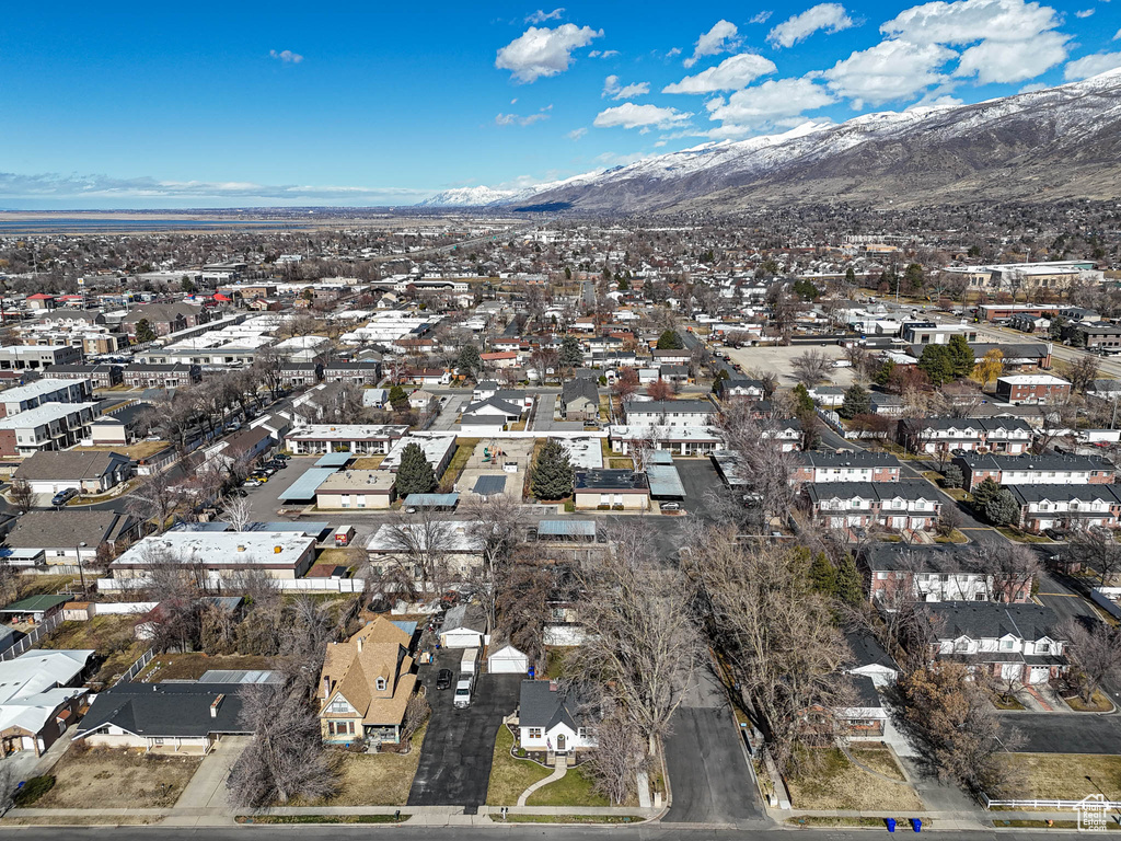 Drone / aerial view with a residential view and a mountain view
