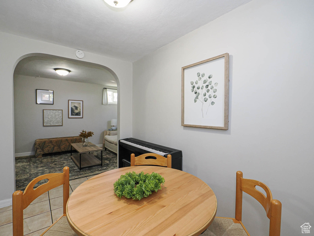Dining space featuring arched walkways