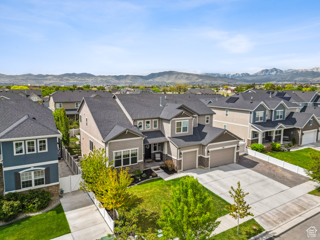 Aerial perspective of suburban area featuring a mountainous background