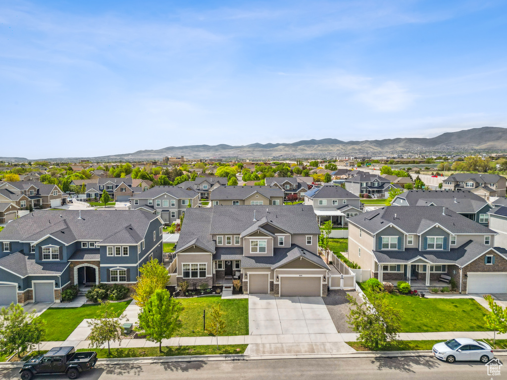 Aerial view of residential area with a mountainous background