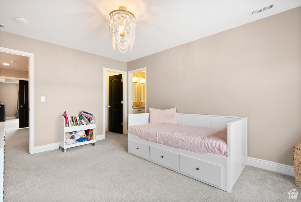 Bedroom featuring baseboards, visible vents, and light colored carpet