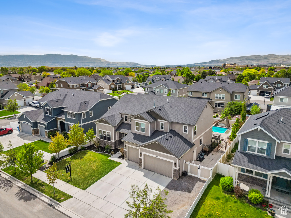 Aerial view of residential area with a mountainous background