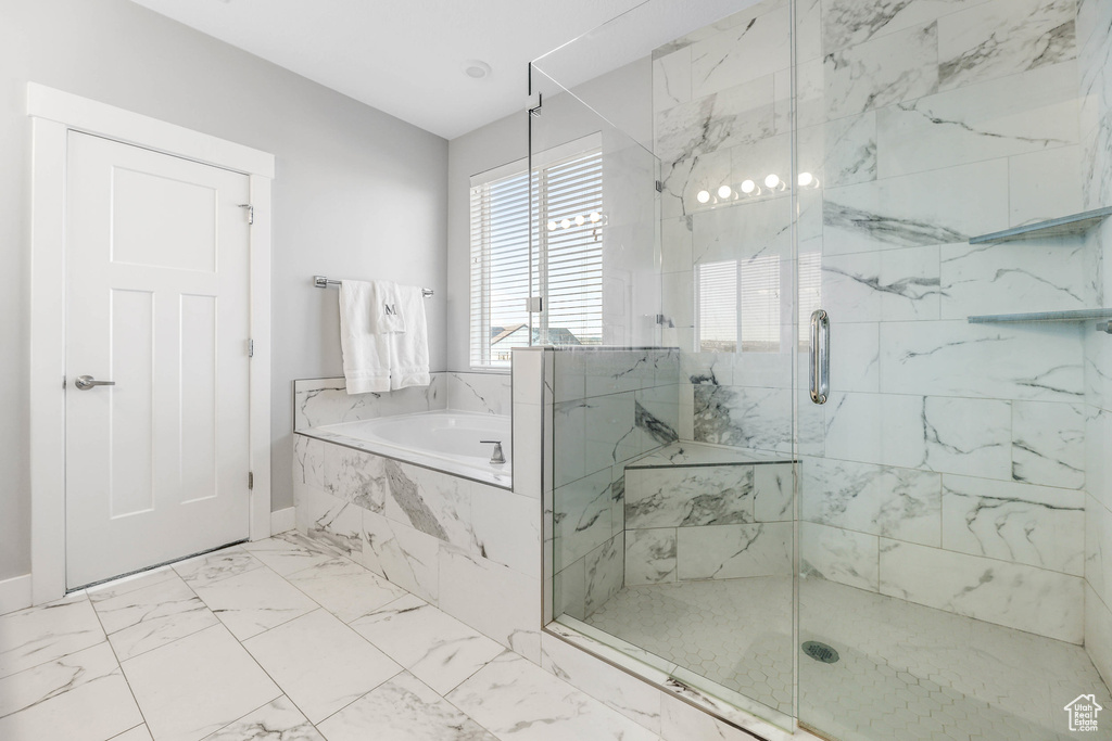 Full bath with a garden tub, a marble finish shower, and marble finish floor
