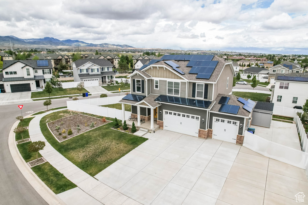 Aerial perspective of suburban area with a mountain backdrop
