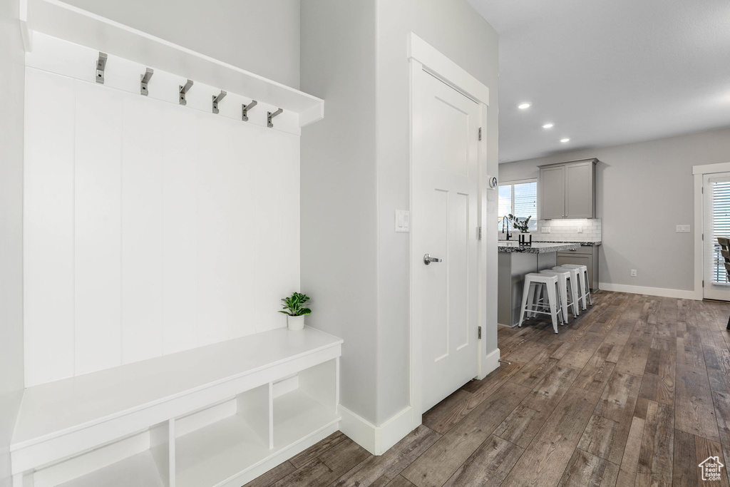 Mudroom featuring baseboards, dark wood-type flooring, and recessed lighting
