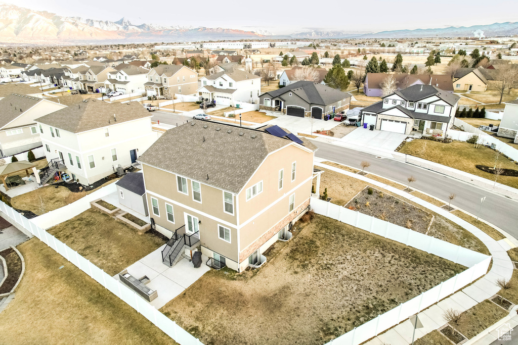 Drone / aerial view with a residential view and a mountain view