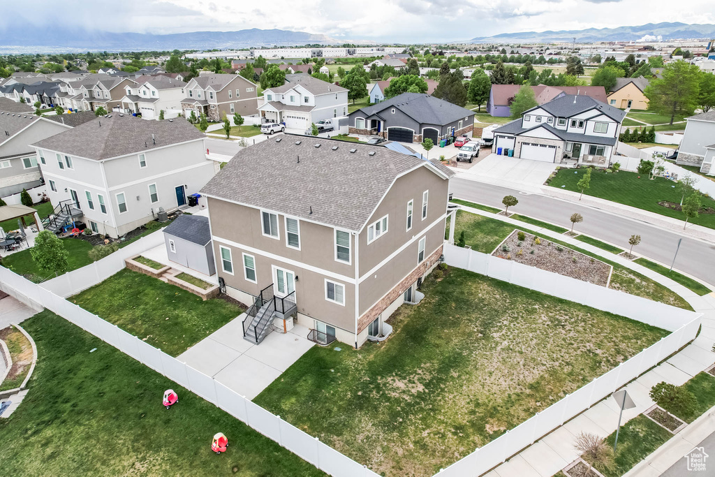 Aerial view of residential area featuring mountains
