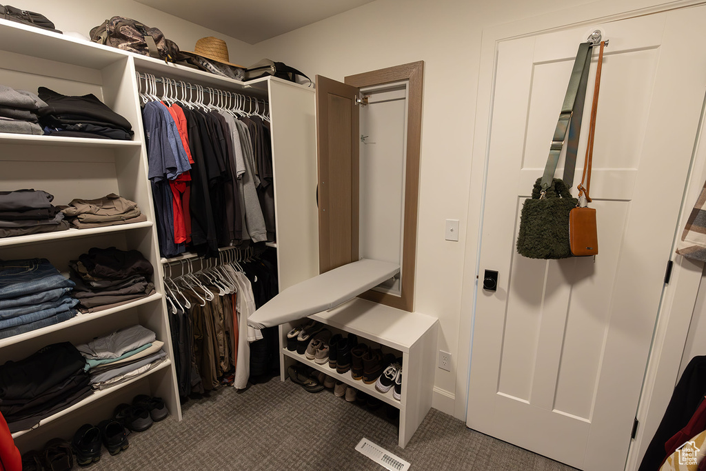 Walk in closet with carpet floors and visible vents