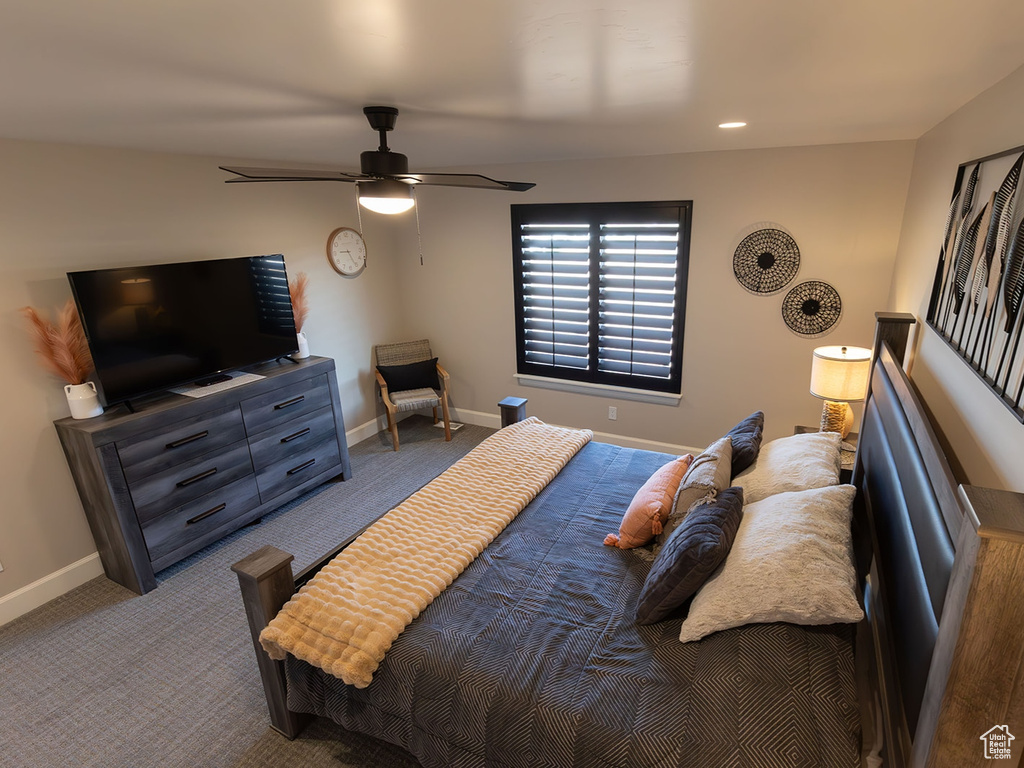 Bedroom featuring recessed lighting, baseboards, a ceiling fan, and light colored carpet