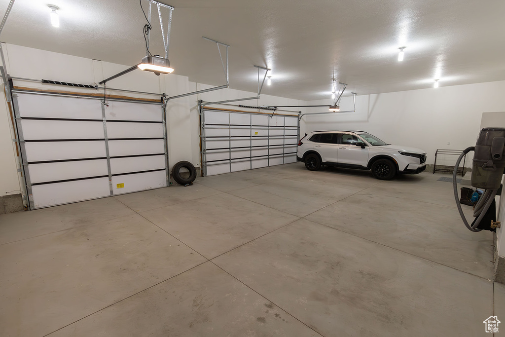 Garage featuring a garage door opener