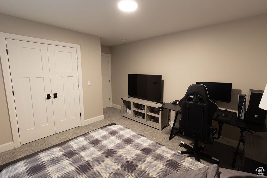 Office with light carpet and baseboards