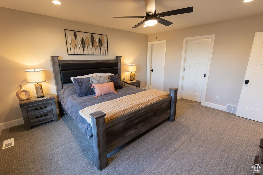 Carpeted bedroom featuring recessed lighting, visible vents, and baseboards