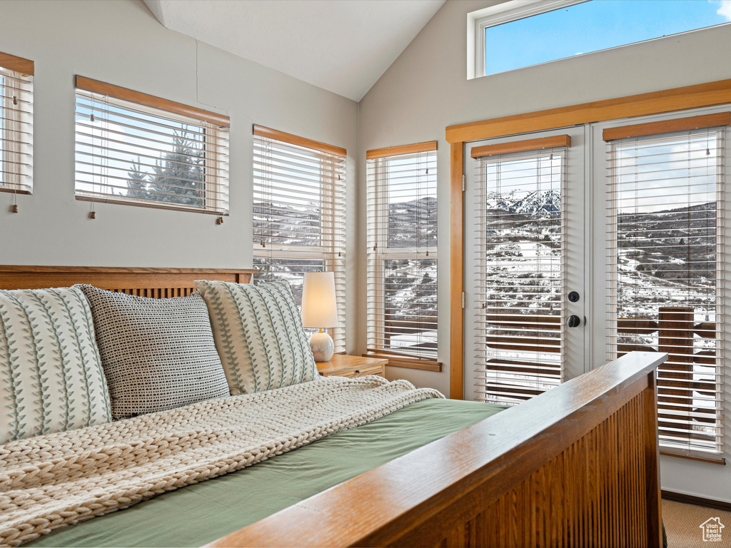 Living area featuring vaulted ceiling