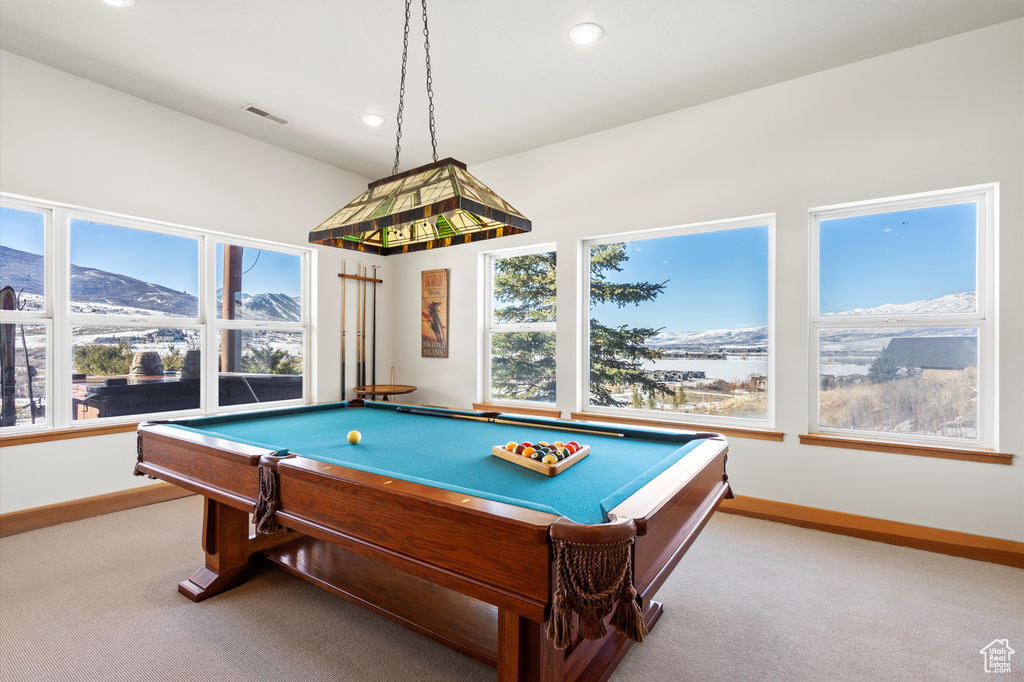 Rec room with carpet floors, recessed lighting, visible vents, a mountain view, and baseboards