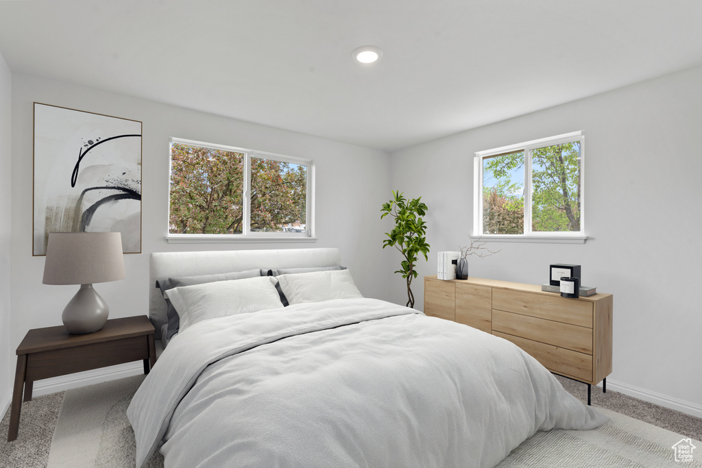 Bedroom featuring baseboards, recessed lighting, and carpet floors
