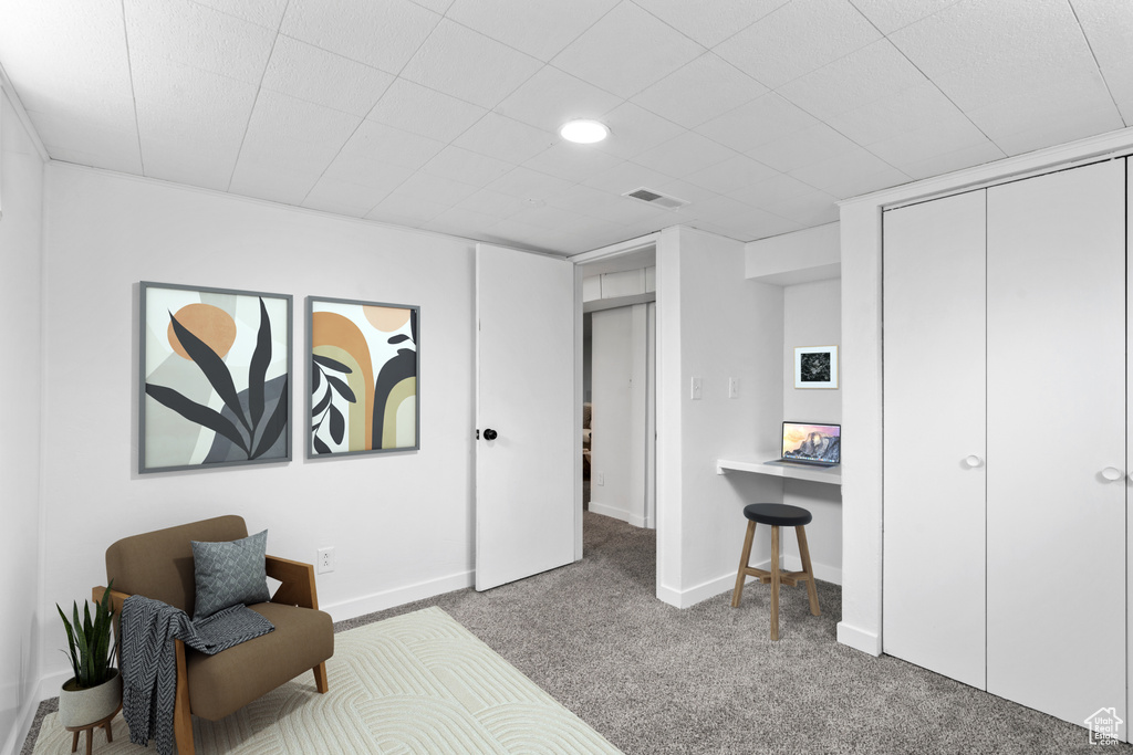 Carpeted bedroom featuring a closet, visible vents, and baseboards