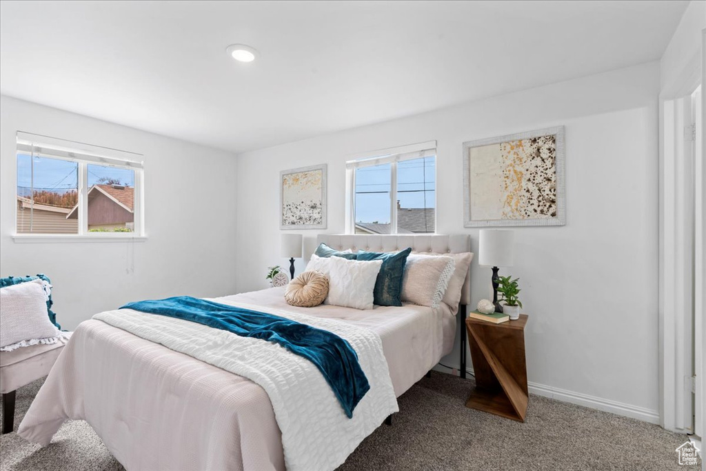 Bedroom featuring recessed lighting, multiple windows, baseboards, and carpet floors