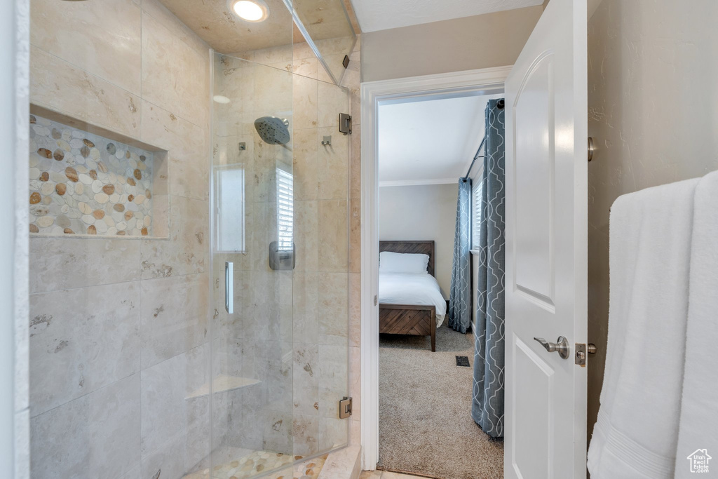 Bathroom with ensuite bath and a shower stall