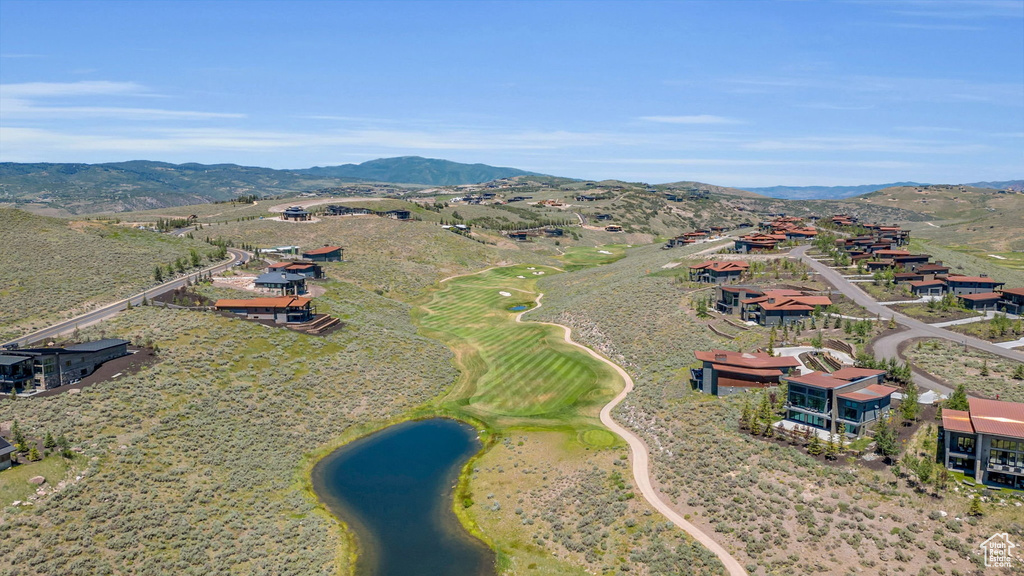 Aerial view of a water and mountain view and a local golf course