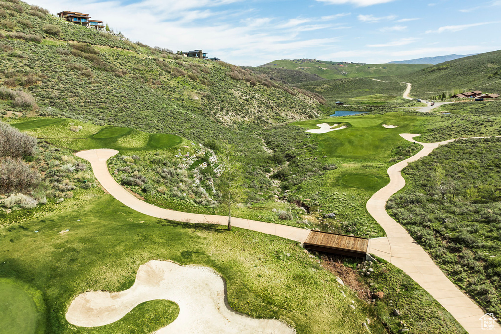 View of home\\\'s community featuring a water and mountain view and view of golf course