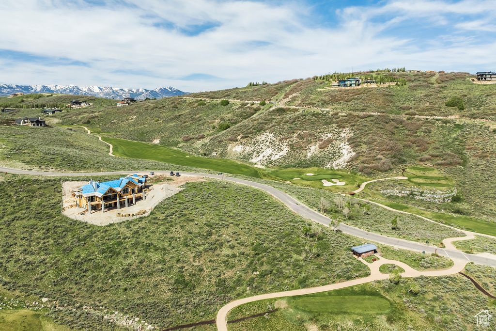 Aerial overview of property\\\'s location with a mountainous background