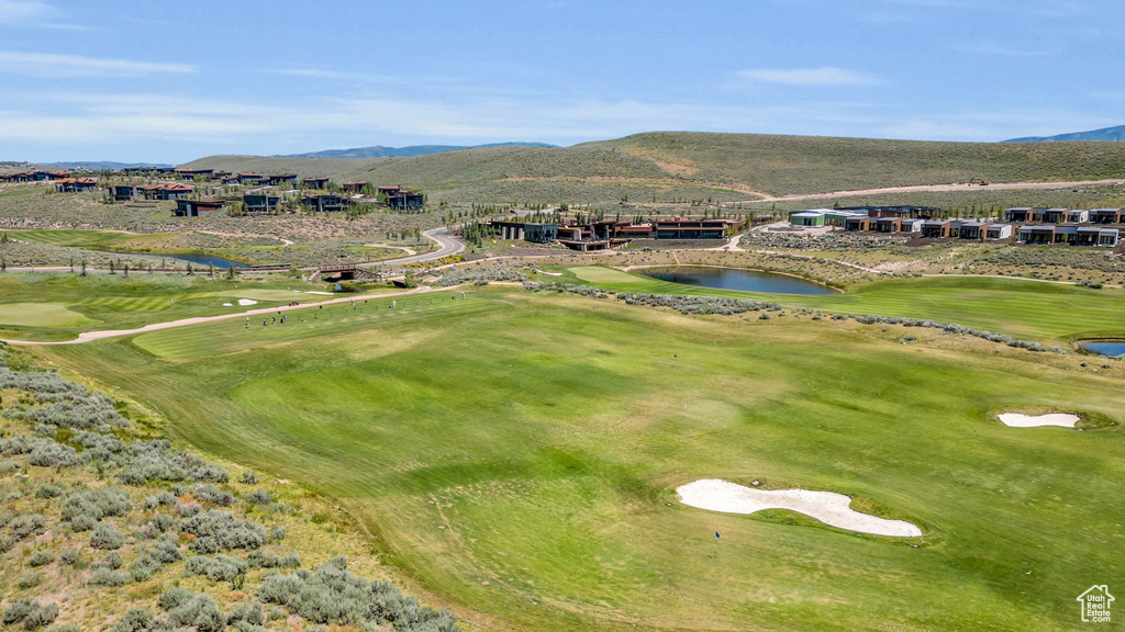Aerial view of a water and mountain view and a golf course
