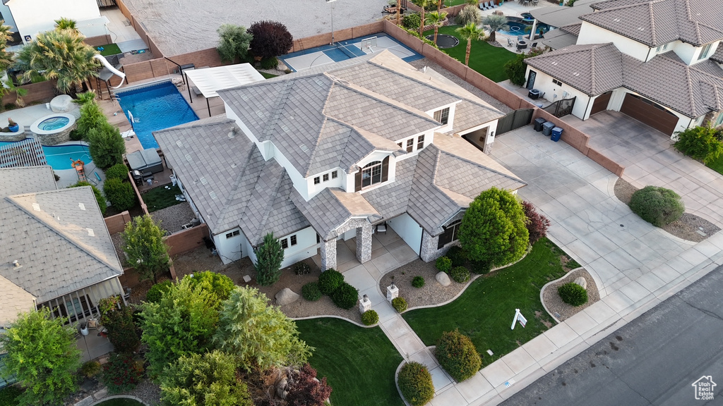 Aerial perspective of suburban area featuring a pool area