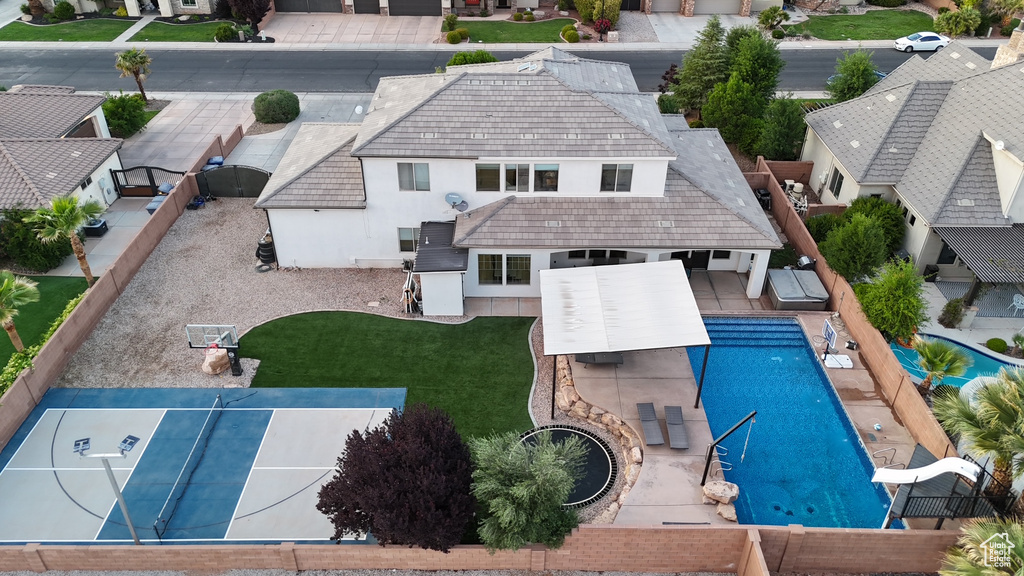 Aerial view of residential area featuring a pool