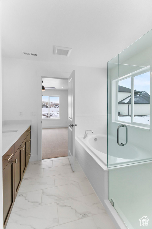 Full bathroom with marble finish floor, visible vents, vanity, a shower stall, and a bath