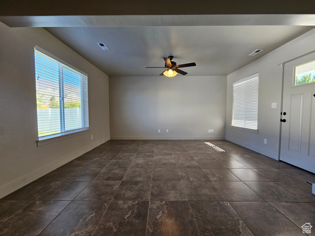 Interior space featuring a wealth of natural light, visible vents, and baseboards