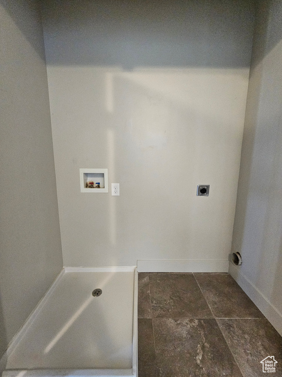 Laundry room with laundry area, baseboards, washer hookup, and hookup for an electric dryer